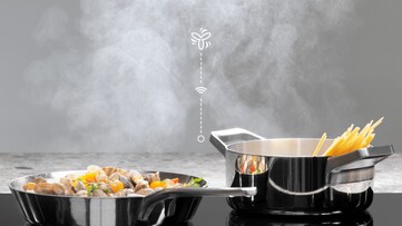 Pan and pot on stove with graphic above.